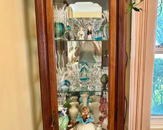 Beveled glass curio cabinet.