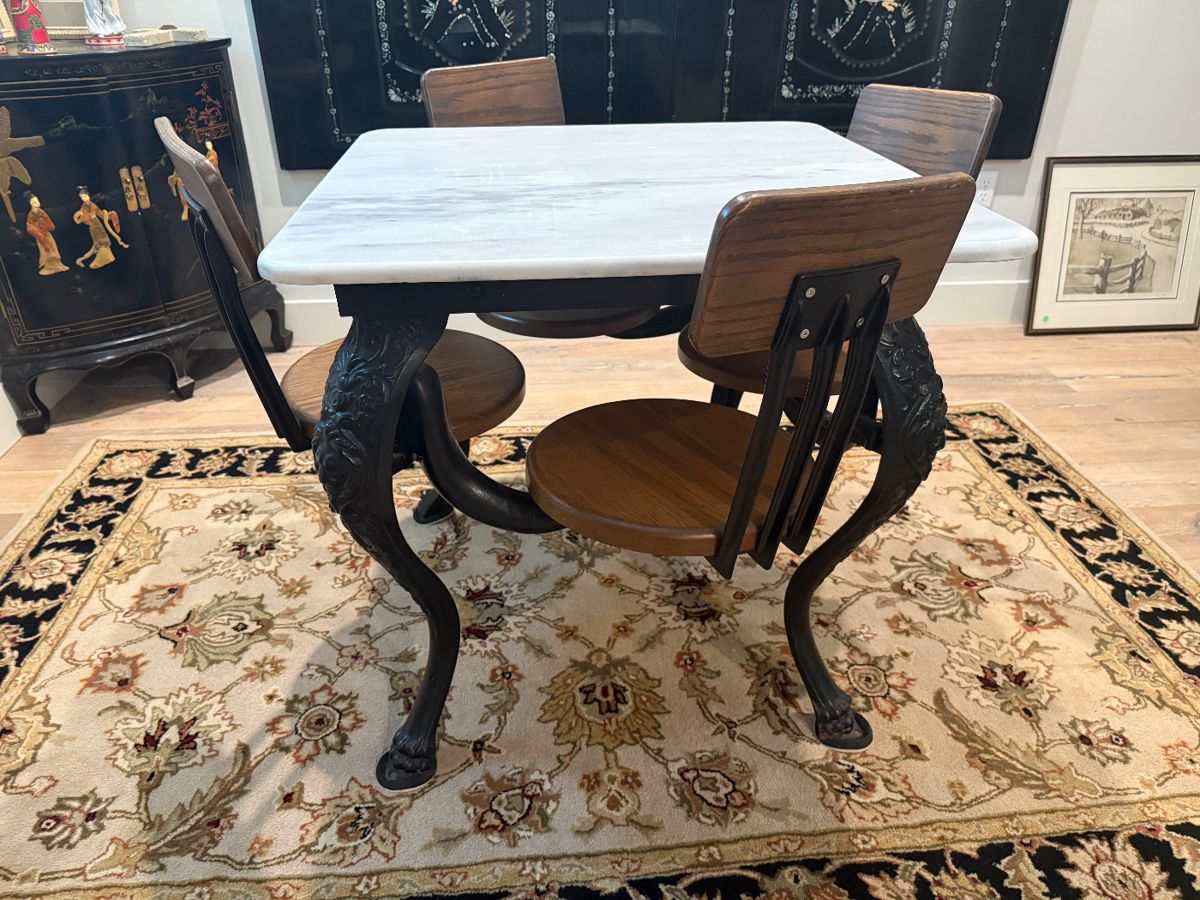 Antique Cast Iron table with marble top and attached swivel stools