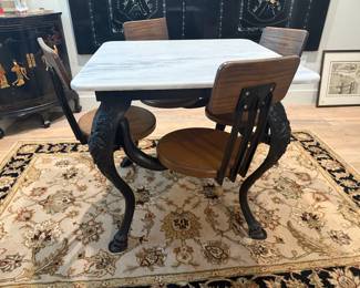 Antique Cast Iron table with marble top and attached swivel stools
