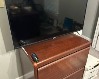 Roku TV and file cabinet (Matching credenza, hutch, and desk available)