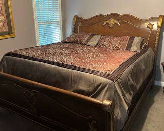 King size bed. (Matching entertainment center, dresser, end table, and mirror available)
