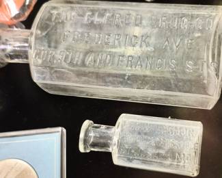 St. Joseph bottles. "Geo. W. Lormor Frederick Ave. Cor. 9th and Francis Sts." and smaller "Geo. W. Lormor Opera House Drugstore St. Joseph, MO" bottles.