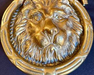 Brass lion head door knocker