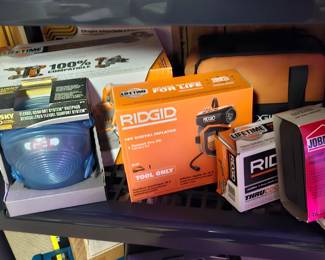 Many unopened power tools new in boxes