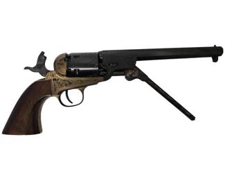 This is an exceptional opportunity to own a meticulously crafted and highly decorative Colt 1851 Navy Revolver, manufactured by the renowned A. Uberti of Italy. This stunning piece is not merely a replica but a true work of art, featuring a color case hardened steel frame, blued steel barrel, cylinder, and loading lever, all intricately adorned with decorative engraving. The .36 caliber cylinder is factory roll engraved with a classic hallmark of the original design. The polished brass triggerguard and grip strap beautifully complement the one-piece walnut grip, finished with a classic satin varnish. This revolver is a masterful tribute to a legendary firearm of the American Civil War and the Wild West.
