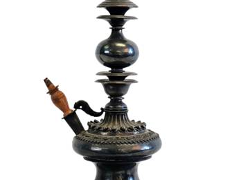 This magnificent antique huka water pipe is a superb and rare example of Indian metalwork, crafted from solid silver. The piece's impressive weight of 4 lbs attests to its quality and substance, making it a highly desirable collector's item. The huka is a work of intricate art, adorned with beautiful hand-engraved designs. It is a testament to the exceptional skill of the artisans who created such functional yet highly decorative objects.