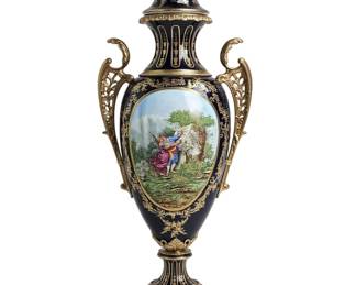 This remarkable table lamp is a striking example of 19th-century French decorative artistry, showcasing the exceptional quality and elegance associated with the Sèvres tradition. The lamp's elegant, urn-shaped body is a canvas for an exquisite series of hand-painted portrait medallions, each a miniature work of fine art. These captivating portraits are framed by a lavish, scrolling gilt motif, which stands out beautifully against the white porcelain. A piece of such fine detail, quality, and prestigious style would serve as an extraordinary statement piece, infusing any space with a sense of sophistication and French grandeur.
