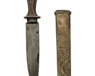 This is an exceptional and rare opportunity to own a piece of history and masterful craftsmanship. This antique ceremonial dagger, originating from Southeast Asia, is a breathtaking example of traditional artistry. The dagger features a striking, finely carved scabbard adorned with a dynamic, coiled dragon motif, a powerful symbol of strength and good fortune in many Asian cultures. The hilt is equally impressive, with an intricate silver-tone wire-wrapped handle that provides a secure grip and a final decorative flourish. This piece is not merely a weapon but a work of ethnographic art, likely created for a ceremonial purpose or as a symbol of status.
