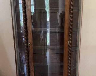 Curved Glass Curio Cabinet with Spindle Detail