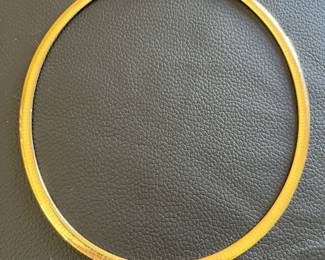 Ladies stamped 14K, 18-inch, 6mm domed omega chain weighing 43 grams.