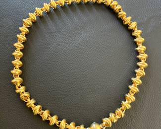 Ladies unstamped 18K, 20-inch, 12.6mm rollo knot chain weighing 71 grams.