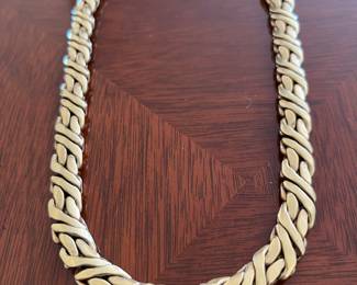 Ladies stamped 14K, 17-inch, 10.3mm woven chain weighing 57.0 grams.