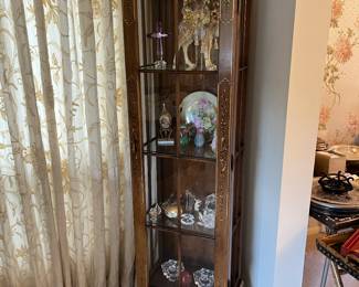Lighted curio cabinet with hand-decorated front.