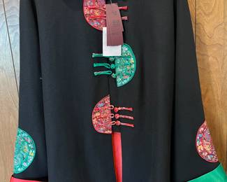 Women’s black tang jacket by Deliniao, size 12-14.