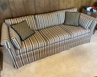 One of two matching upholstered couches in very good condition.