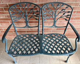 Two-seat metal garden bench.