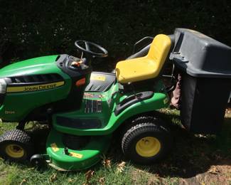 16.  the price 995.00   John Deere d-125, the mower, also included is the bagger attachment, it looks and runs like new