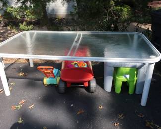 15.  the price 250.00  Winston glass   top patio table   Size  is  43"  x  80". there are 6 chairs