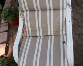 one  of  two  white  chairs  with  cushion