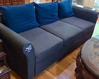 Modern Sectional Sofa with Blue Accent Pillows 