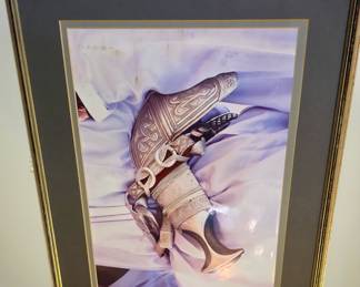 A framed photograph of a traditional Omani khanjar, a ceremonial dagger 