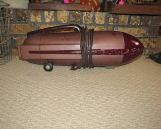 Vintage torpedo shaped Kenmore vacuum cleaner