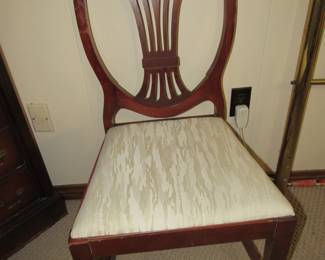 One of six mahogany shield-back chairs