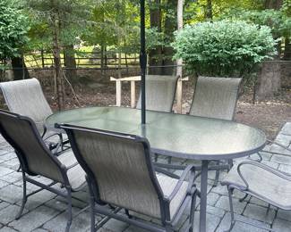 Patio table with six chairs and umbrella 