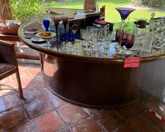 This custom bar can be yours. It also has a sink cabinets on the other side. The bottom might be hard to do, but I think someone could in fact, utilize a solid walnut bar top.