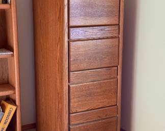 This Oak Colossus is a legal sized (wide!) four drawer filing cabinet. It'd be close to a bank vault if I had the keys for the lock. Fortunately you can buy a replacement lock and key set on Amazon for virtually nothing if you're planning on locking your treasure up in this beast. I have the hand truck, but you bring your muscles.