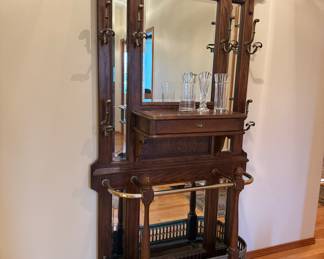 This entry piece has epic Victorian vibes. Alas, my reflection in the mirror has scared the bejeezus out of me walking in the front door at night more times that I can count and I won't miss it. 
