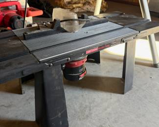 Solid steel Craftsman router table + Router. I've also got some really nice Rockler router bits, and another router.