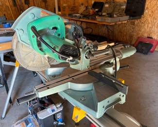 Hitachi compound miter saw mounted a Dewalt miter saw stand with adjustable stops. This thing is SUPER handy.