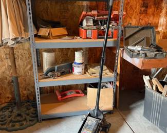Multiple different sanders, plus a heavy duty floor jack for when you need to jack yourself up taller to sand the high spots. Not really sure why the jack is out with all the wood working tools, but my step dad was smarter than me and I ain't asking questions..