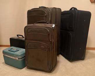 A tidy collection of Samsonite luggage, including a very nice green  rolling carry-on with a larger matching checked piece. That black Samsonite briefcase could be readily paired with some of the vintage camera gear for your next secret agent adventure.