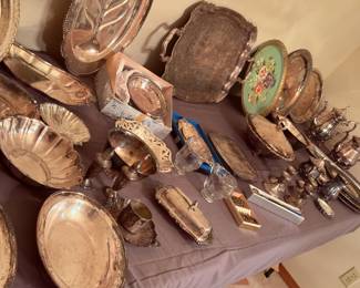Lots of vintage serving wear, mostly silver plate, but still charming. Who doesn't need a silver teapot or two?