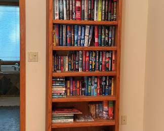 Books, books, books... and bookcases. Also a healthy collection of DVDs and CDs if you're still rocking old school physically owned media. Boycott streaming! Tim Cook makes enough money already. Many many more books that what you see here. Keep reading for authors...