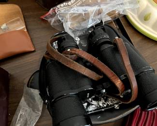 old binoculars with leather strap