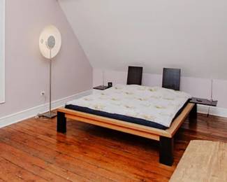 Queen bed from Germany with futon mattress and removable side tables and headrests $650
