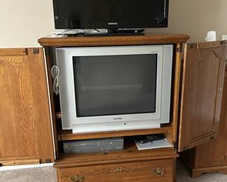 Solid oak entertainment center. 
Two TV’s 
DVD player
