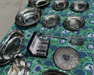 Lots of sterling and silver plate. Two Wallace sterling 10" bowls, 4 Stieff sterling bread and butter plates monogrammed, 4 Eales of Sheffield salt and pepper shakers in case, Reed & Barton tray, Gorham dish, shell dish, biscuit tin/ice bucket, gravy boat