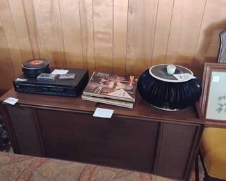 Console stereo with vinyl record collection.
