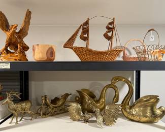 All vintage. Wood items – eagle, bowl, and One King’s Lane wicker ship. Brass reindeer and sleigh, fighting cooks, and swan platers.