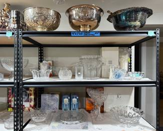 Silver-plated punch bowls, ladles, and cups – have three different ones. Various lead crystal items such as a champagne ⁄ wine cooler, vases, bowls, platters, glasses, candle holders, etc.