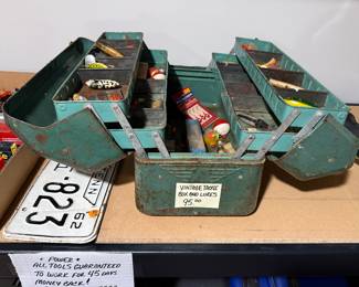 Vintage fishing lure box and lures.