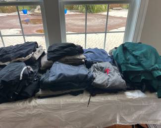 Many pieces of clothing and hats