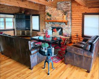 Living Room with Leather Sofas, Adjustable Iron Table, Woven Rug, Cocktail Table, Mantle