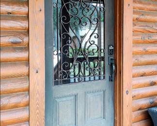 Front Entry Door with glass and ornamental iron.