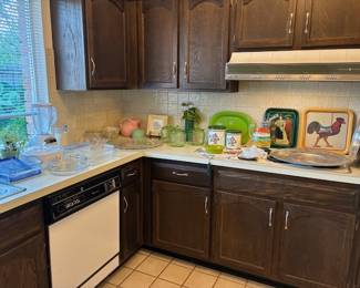 Various kitchen items including Depression Glass cookie jars