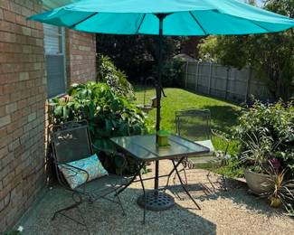 Wrought iron chairs, table, umbrella, pillows